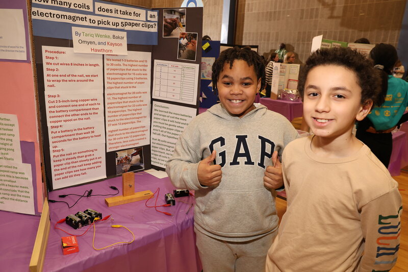 Students presenting their electromagnet experiment at the WHJESP S.T.E.A.M. Fair